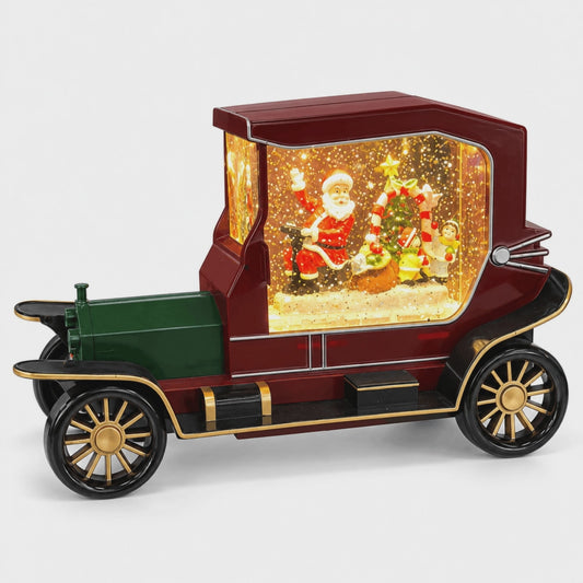 Decorațiune muzicală de Crăciun cu automobil retro și scenă luminoasă cu Moș Crăciun